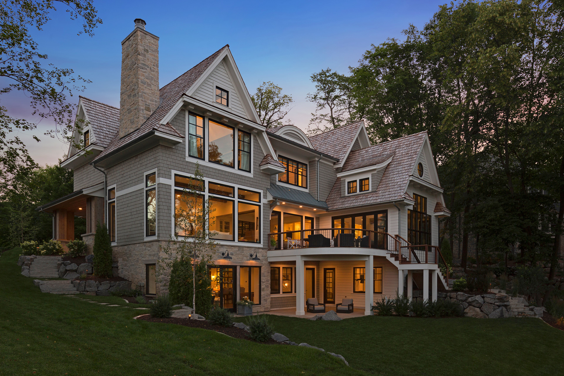 New home at dusk with glowing windows